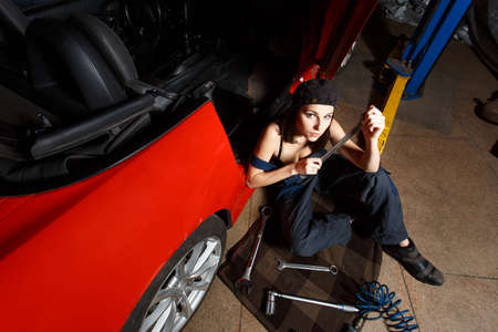 girl mechanic in a garageの写真素材