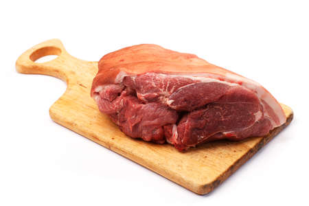 meat on a board on a white backgroundの写真素材