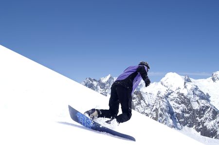 Snowboarder in Caucasus Mountains. Winter resort Dombaj.の写真素材