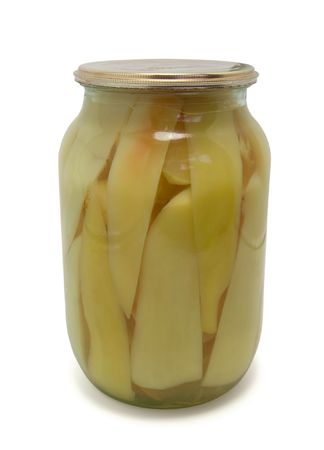 Tinned bell peppers in glass bank on white backgroundの写真素材