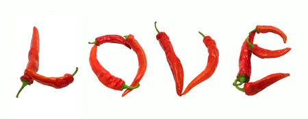 Love text composed of chili peppers. Isolated on white background.の写真素材