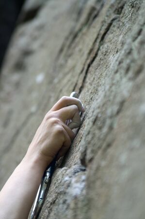 Climbers hand and quick-draws. Close-upの写真素材