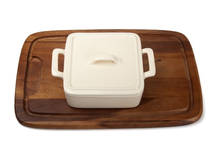 Ceramic pot for stove on wooden kitchen boardの写真素材