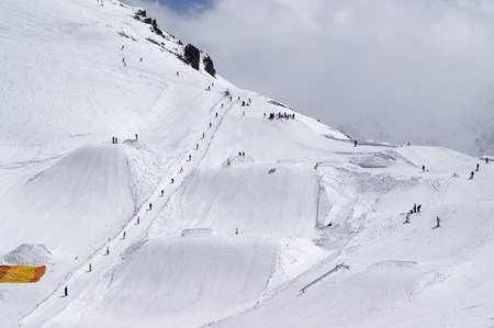 Snowboard park at ski resort. Dombay, Caucasus Mountains.の写真素材