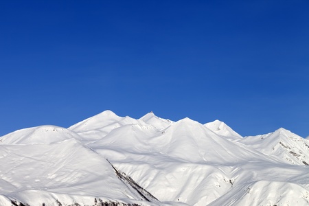 Snowy mountains and blue sky  Caucasus Mountains, Georgia, Gudauri の写真素材