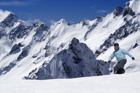 Snowboarding in high mountainsの写真素材