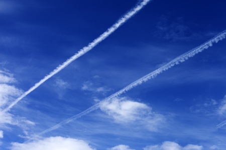Blue sky with contrails in sunny day