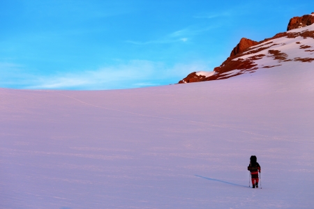 Hiker in sunrise snow mountains. Turkey, Central Taurus Mountains, Aladaglar (Anti-Taurus).の写真素材