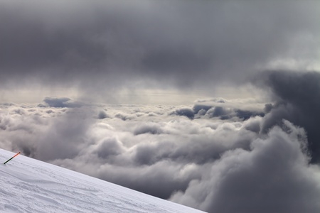 Ski slope for slalom and overcast sky. Georgia, ski resort Gudauri. Caucasus Mountains.