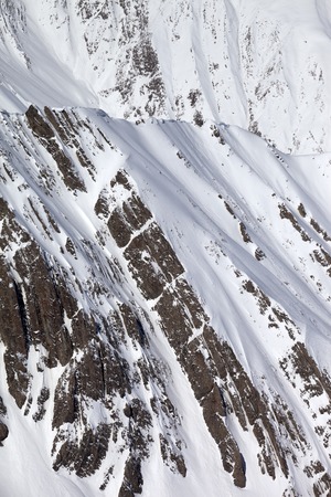 Snowy winter rocks. Caucasus Mountains, Georgia, view from ski resort Gudauri.の写真素材