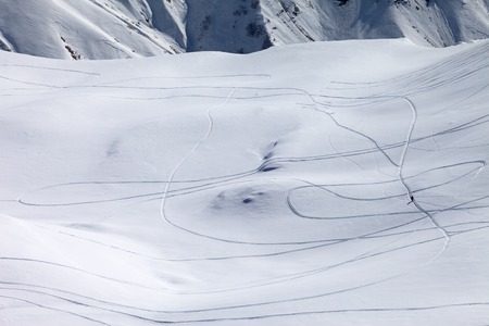 View on snowy off piste slope with trace from ski and snowboards. Caucasus Mountains, Georgia, ski...
