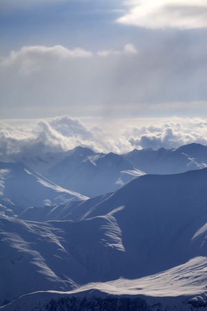 Winter mountains in evening haze. Caucasus Mountains, Georgia, ski resort Gudauri.の写真素材