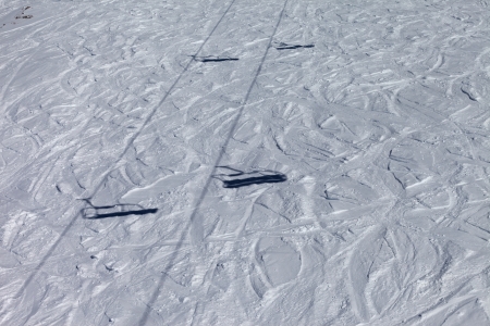 Shadows from chair lift on off-piste slope. Georgia, ski resort Gudauri. Caucasus Mountains.の写真素材