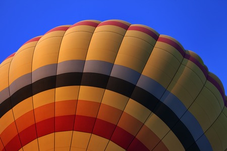 Hot air balloon on blue sky. Close-up view.の写真素材