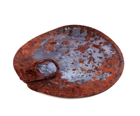 Old rusty cap of tincan isolated on white background. の写真素材