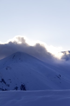 Off-piste slope at evening. Caucasus Mountains, Georgia, ski resort Gudauri.