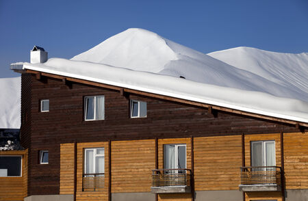Snowy hotel in winter mountains at nice day. Caucasus Mountains, Georgia, ski resort Gudauri.のeditorial素材