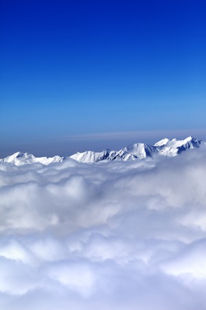 Cloudy mountains at nice winter day. Caucasus Mountains, Georgia, ski resort Gudauri.の写真素材