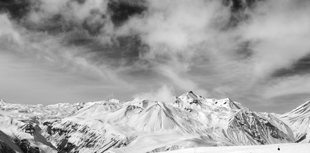 Black and white snowy mountains at wind day. Panorama Caucasus Mountains, Georgia. Ski resort, Gudauri.の写真素材