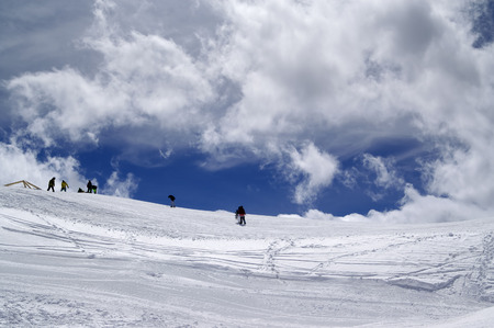 Ski slope in sun wind day. Caucasus Mountains, ski resort Dombay.の写真素材