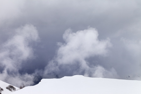 Off-piste slope in mist. Caucasus Mountains, Georgia, ski resort Gudauri.の写真素材