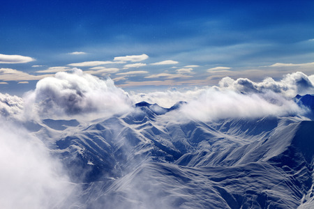 Christmas landscape with falling snow. Caucasus Mountains in evening, Georgia, region Gudauri.の写真素材