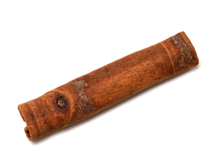 Cinnamon stick isolated on white background. Close-up view.
