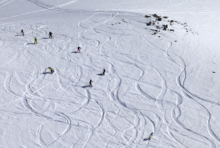 Snowboarder downhill on off piste slope with newly-fallen snow. Caucasus Mountains, Georgia, ski resort Gudauri.の写真素材