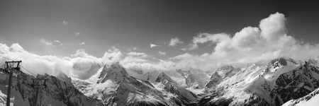 Black and white panoramic view from ski resort in nice sun day. Caucasus Mountains, region Dombay.の写真素材
