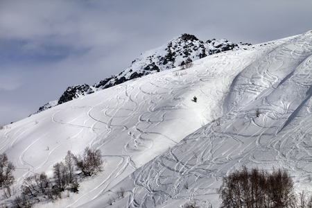 Off-piste slope with traces from skis and snowboards. Caucasus Mountains, Tetnuldi, Svaneti region...