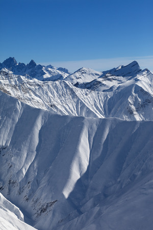 Snow mountains in nice sun evening. Caucasus Mountains, Georgia, region Gudauri at winter.の写真素材