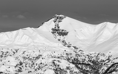 Black and white snowy winter mountains at sun evening. Caucasus Mountains, Shahdagh, Azerbaijan.の写真素材