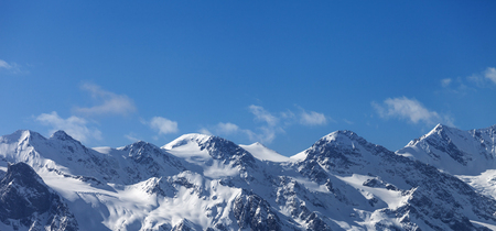 Panoramic view on snowy mountains and glacier in nice sunny evening. Caucasus Mountains at winter. Svaneti region of Georgia.の写真素材
