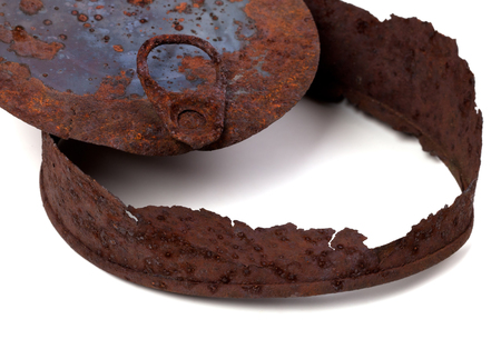 Part of old old rusty tin can isolated on white backgroundの写真素材