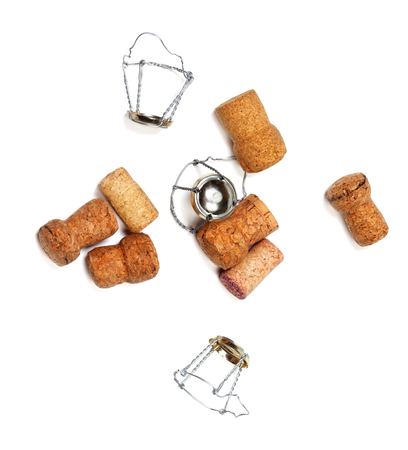 Corks from champagne wine and muselets. Isolated on white background. View from above.の写真素材