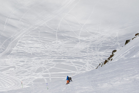 Two snowboarders before descend on freeriding trace at sunny cold day. Caucasus Mountains in winter, Georgia, region Gudauri.の写真素材