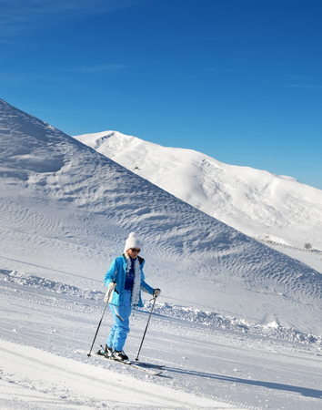 Skier on snowy ski slope at nice sunny day. Greater Caucasus in winter, Shahdagh, Azerbaijan.の写真素材
