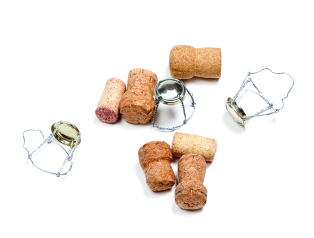 Corks from champagne wine and muselets after celebrate. Isolated on white background. の写真素材