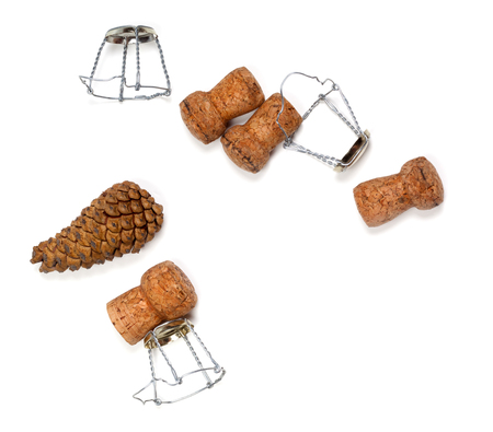 Fir cones and champagne wine corks with muselet. Isolated on white background.の写真素材
