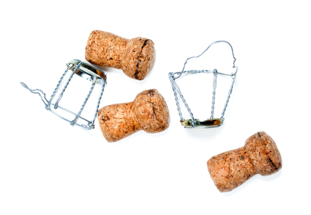 Corks from champagne wine and muselets after party isolated on white backgroundの写真素材