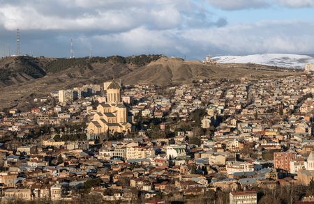 Tbilisi city view, capital of Georgia at sunny day. Mtatsminda Mount with TV tower and Holy Trinity...