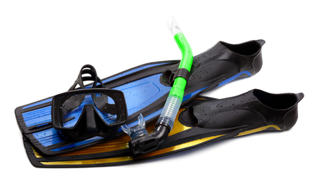 Mask, snorkel and swim flippers of different colors with water drops. Diving gear isolated on white background.の写真素材