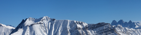 Panoramic view of snowy mountains at sunny winter day. Caucasus Mountains, Georgia, region Gudauri.の写真素材