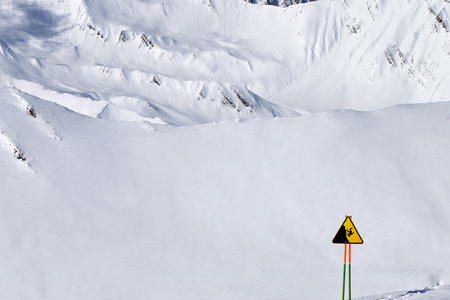 Warning sign before snow off-piste slope for freeriding. Caucasus Mountains, Georgia, region Gudauri at sunny winter day.の写真素材