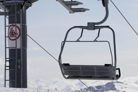 Ropeway on ski resort in high mountains at winter evening. Close-up view.の写真素材