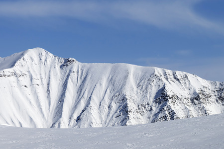 Sunlit snowy mountains and off-piste ski slope at winter. Caucasus Mountains, Georgia, region Gudauri.の写真素材