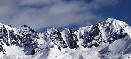 Winter snowy mountains at nice sunny day. Panoramic view from chair lift on Hatsvali, Svaneti region of Georgia. Caucasus Mountains.の写真素材