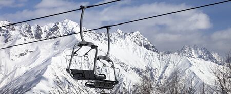 Chair lift in snowy mountains at nice sunny day. Caucasus Mountains. Hatsvali, Svaneti region of Georgia at winter. Panoramic view.の写真素材