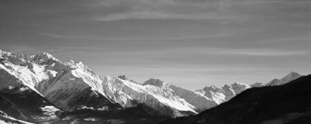Panoramic view on snowy mountains in nice sunny morning. Caucasus Mountains at winter. Svaneti region of Georgia. Black and white toned landscape.の写真素材