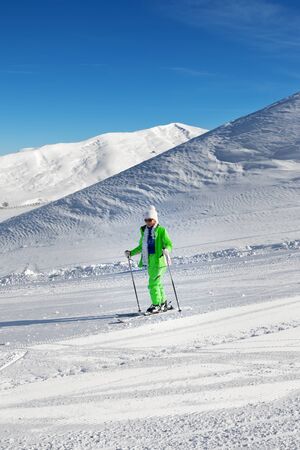 Skier on snowy ski slope at nice sunny day. Greater Caucasus in winter, Shahdagh, Azerbaijan.の写真素材
